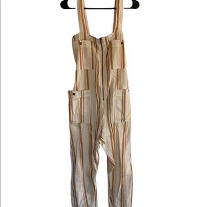 Billabong cream romper size small with orange stripes